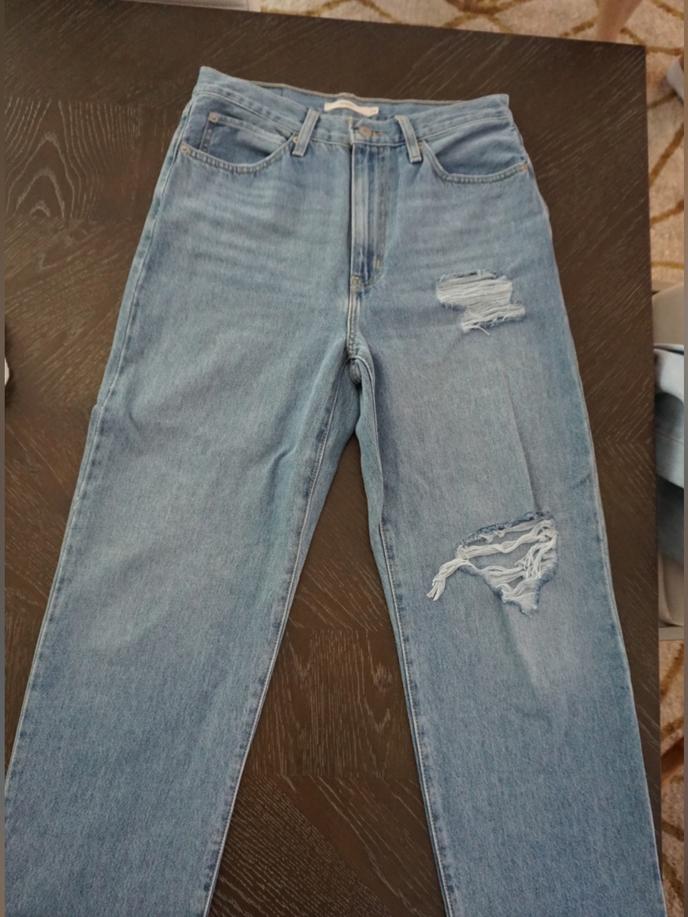 Levi's Women's Straight Leg Jeans in Light Blue with Distressed Details
